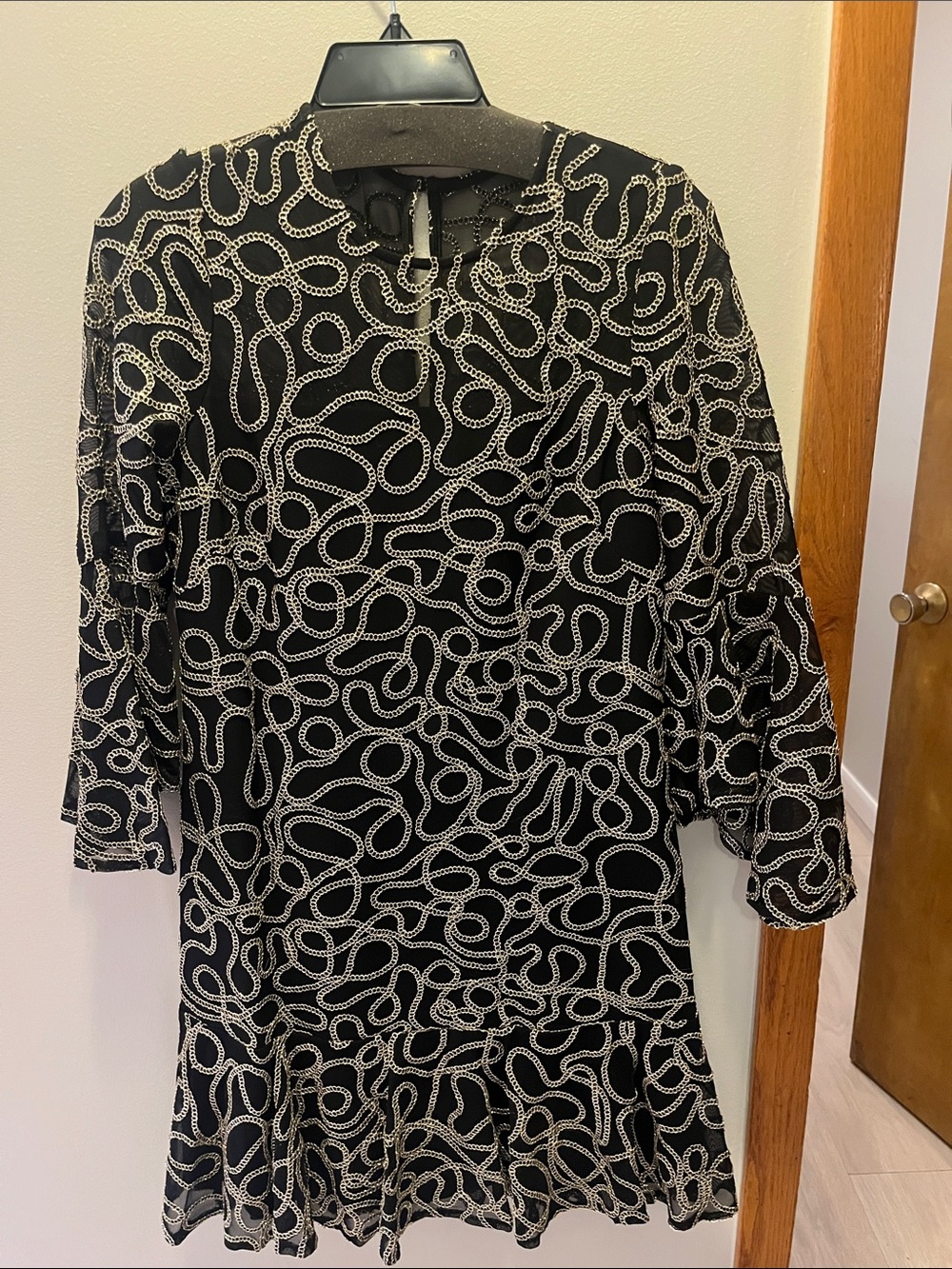 Jessica Howard Black Dress with Gold Chain-Print and Ruffle Hem and sleeves